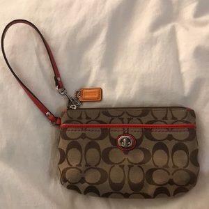 Coach wristlet with classic coach pattern